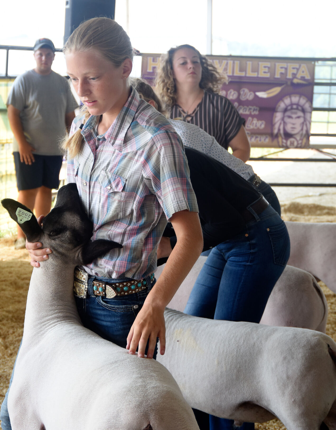 Nikki Crocker holds a sheep's head